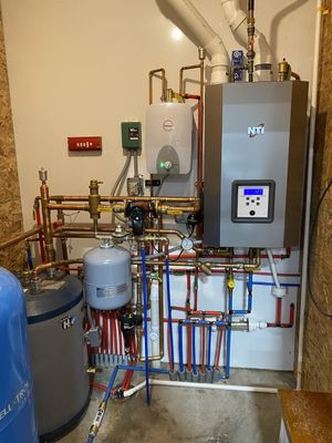 A "combi" boiler system in a barndominium.